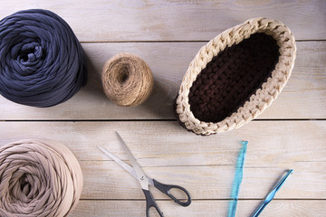 Fototapeta na wymiar Top view of colored yarn balls and knitting tools.