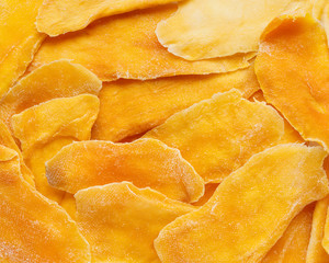 Dehydrated mango as a background. Dried fruits. Natural healthy candy. © geshas