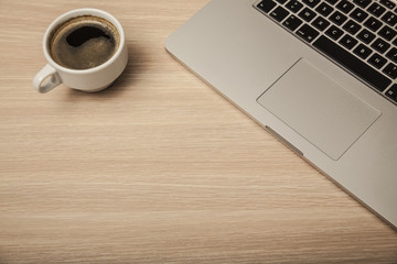 cup of coffee and a computer on the office desk