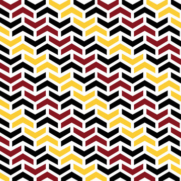 Abstract zigzag arrows vector pattern in black, red and yellow colors 
