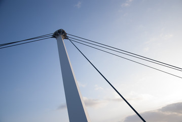 Fototapeta premium Detail of cable-stayed bridge against the blue sky