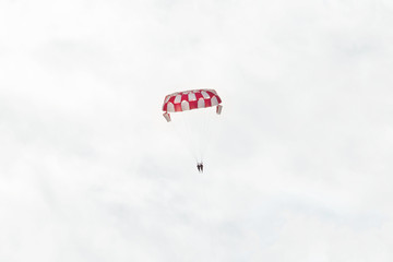 high parasailing in the sky with clouds