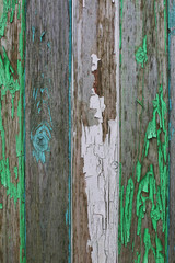 Old ambar wooden background with faded green and blue colors. Loft style. 