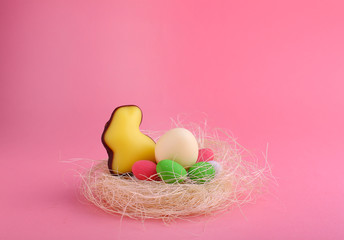 Sweets for celebrate Easter. Candies in shape of easter bunny and chocolate eggs. Copy space.