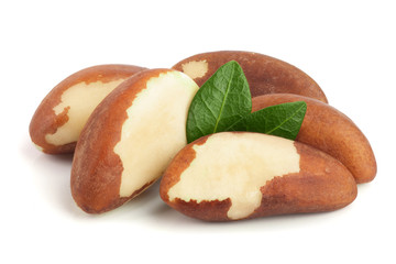 Brazil nuts with leaves isolated on white background closeup. Full depth of field