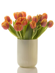 Tulips bouquet in vase isolated on white background