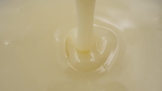 Pouring Sweetened condensed milk. Slow motion