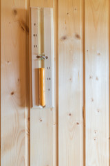 Hourglass or Sand Clock in the sauna room the control time over for healthy and relaxation   wooden wall.