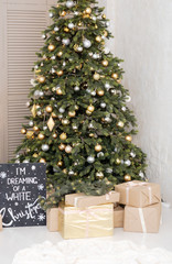 Many boxes with a christas gifts near the tree