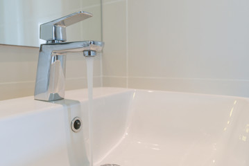 Modern faucet with ceramic washbasin sink