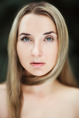 Obraz premium Beautiful blondie model is emotionally posing on a dark background