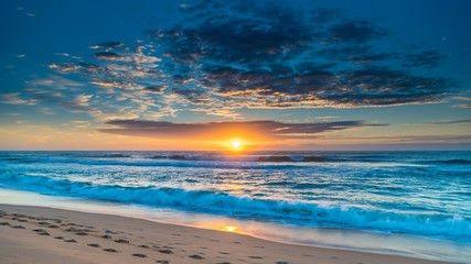 Fototapeta na wymiar Sunrise Seascape from the Beach