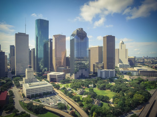 Fototapeta na wymiar Aerial view Houston downtown and Gulf Freeway (highway I45). Daytime cityscape with cloud blue sky. Vintage tone.