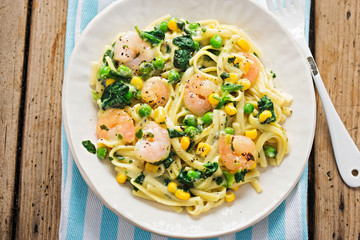 Creamy king prawn tagliatelle with pea, spinach and sweet corn 