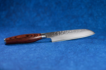 Sharp nice Japanese knife on blue background