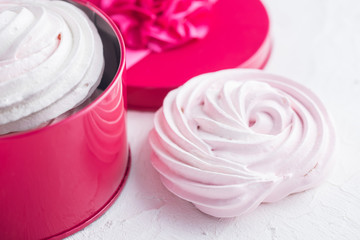 Raspberry meringue on concrete desk. Space for text. Close up view. Romatic wedding. 