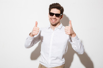 Portrait of a cheerful young man dressed in shirt