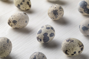 quail eggs photo large on the table and in the nest