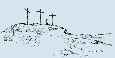 Three crosses stand on  light sky backdrop