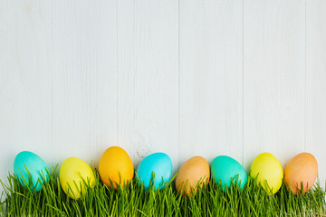 colored Easter eggs on the grass
