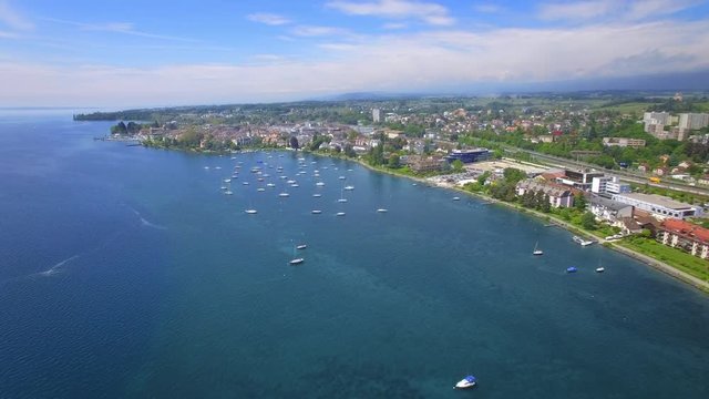 Lake Geneva, Lausanne area. Cinematic drone shot by the lake