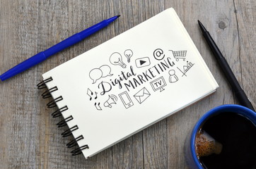 DIGITAL MARKETING with symbols in notepad