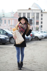 French woman with baguettes in the bag 