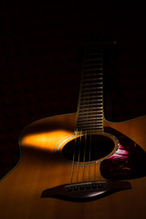 Acoustic guitar on black background