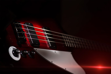 Vintage style electric bass on black background
