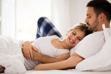 Young couple having having romantic times in bedroom
