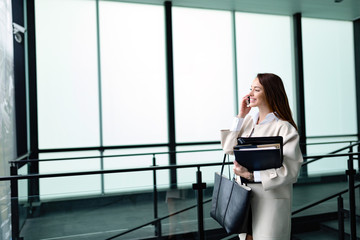 Portrait of young businesswoman going to office