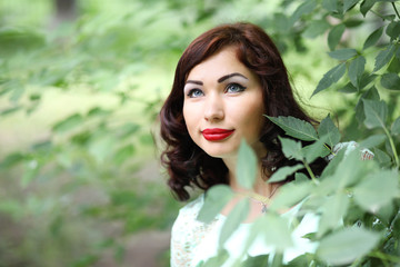 Beautiful girl in a spring leaf park