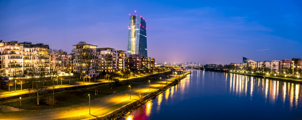 The skyline of Frankfurt, Germany, with the European Central Bank tower at night - All logos and brands removed