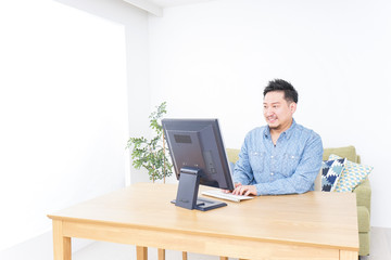 Man using laptop at home