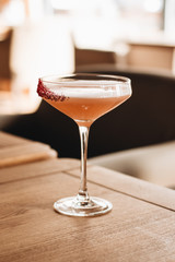 Delicious alcohol cocktail on wooden table