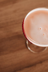 Delicious alcohol cocktail on wooden table