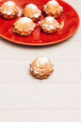 Delicious sweet cupcakes on red plate, delicious homemade dessert