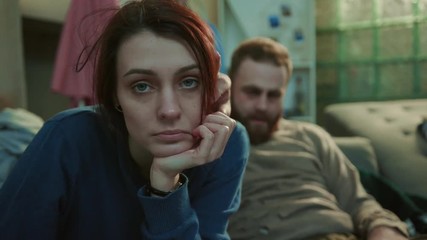 Close up drunk alcoholic young couple sit on sofa woman look at camera man sleep stress unhealthy creepy home desperate depressed sad adult alcoholism frustrated problem cheers tired portrait - Powered by Adobe