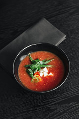 Delicious tomato soup with parsley and pepper