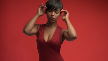 lady woman in red on red mixed race african american woman in red dress on red background
