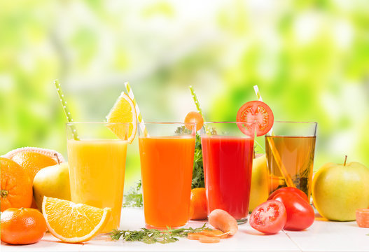 Juice mix drink. Tomato, Orange, Apple and Carrot smoothie drink on white background with fresh fruits and  vegetable. 