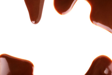 Chocolate syrup drips in shape of light bulb isolated on white