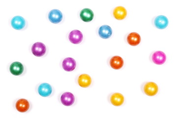 Colorful decorative glass pebbles, balls isolated on white background, top view
