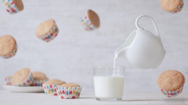 Cinemagraph - Milk pouring into glass. Nobody. Motion Photo.