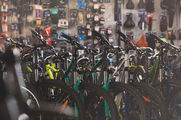 selective focus of various modern bicycles selling in bike shop