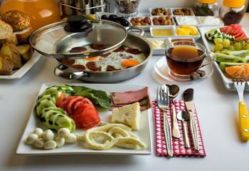 Traditional Turkish breakfast in the stylish breakfast plates at the white background.Close up taken,isolated,top view.