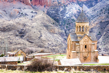 Fototapeta na wymiar Medieval armenian Noravank monastery complex against red mountains, Armenia