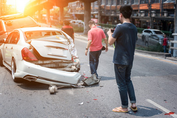 Auto accident involving two cars on a city street