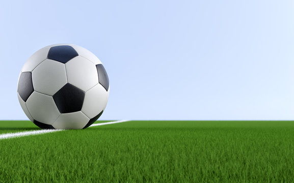 Soccer ball on the white line of a soccer field. Copy space on the right side - 3D Rendering