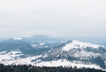 Fototapeta na wymiar Beautiful winter landscape with snowy mountains